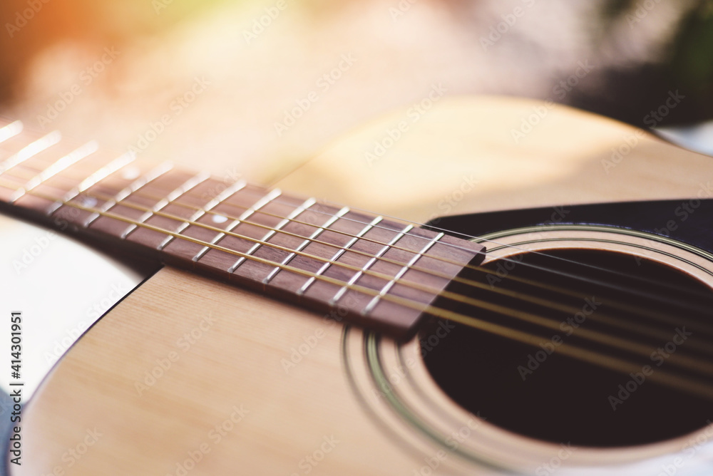 Fototapeta premium Home hobbies - Close up acoustic guitar Musical instrument for recreation or hobby passion concept.
