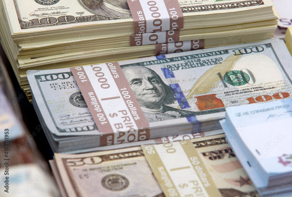 souvenir,not real, banknotes of 100 US dollars and 50 US dollars, closeup. souvenir,not real, banknotes of 100 US dollars and 50 US dollars, closeup.