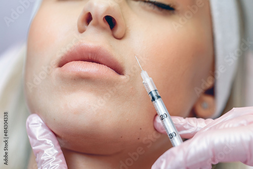 Close up cosmetic procedures for facial beauty. Anti-aging cosmetic injections. Female beauty concept