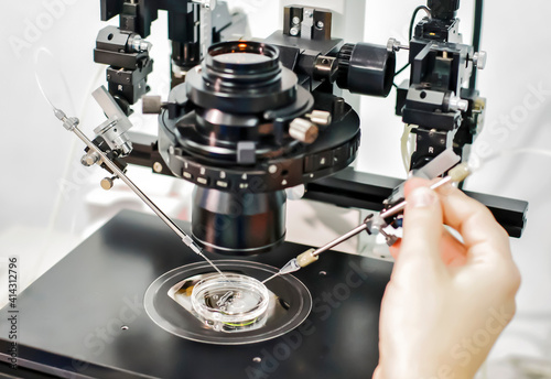 Medical research using the microscope in a laboratory of a Clinic of Reproductive medicine,closeup.
