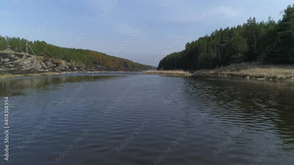 Aerial drone view of Old suspension bridge over the river. There is a pine forest on the banks of the river. Seagulls are flying. Summer sunny day. The camera flies back
Aerial drone view of Old suspension bridge over the river. There is a pine forest on the banks of the river. Seagulls are flying. Summer sunny day. The camera flies back