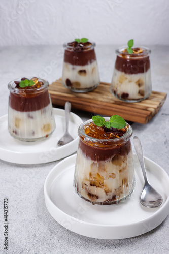 Puding Coklat Vanila. Chocolate and vanilla puddings are a desserts with chocolate and vanilla flavors topping with jelly pearls. 