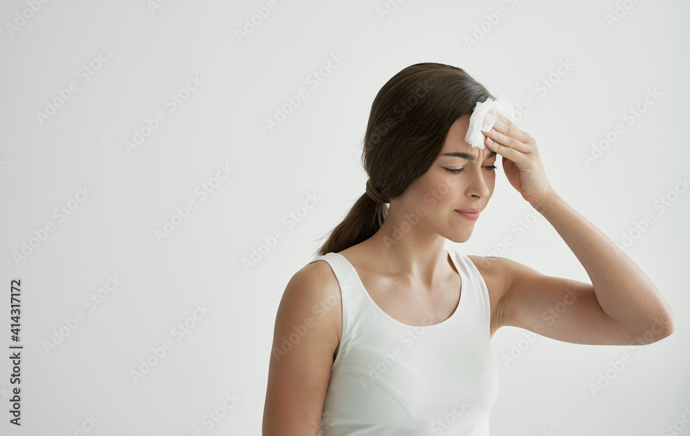 woman wiping her face with a handkerchief feeling unwell health cold woman wiping her face with a handkerchief feeling unwell health cold