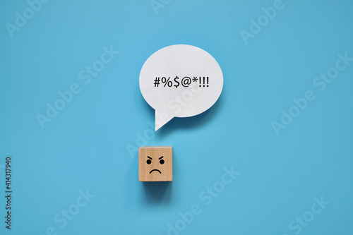 A wooden cube with an angry face and the inscription: I am angry. The person is angry and talks about it photo