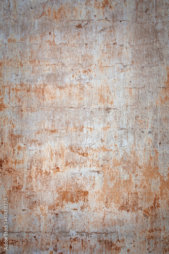 old brick wall with layers of old plaster and paint, background