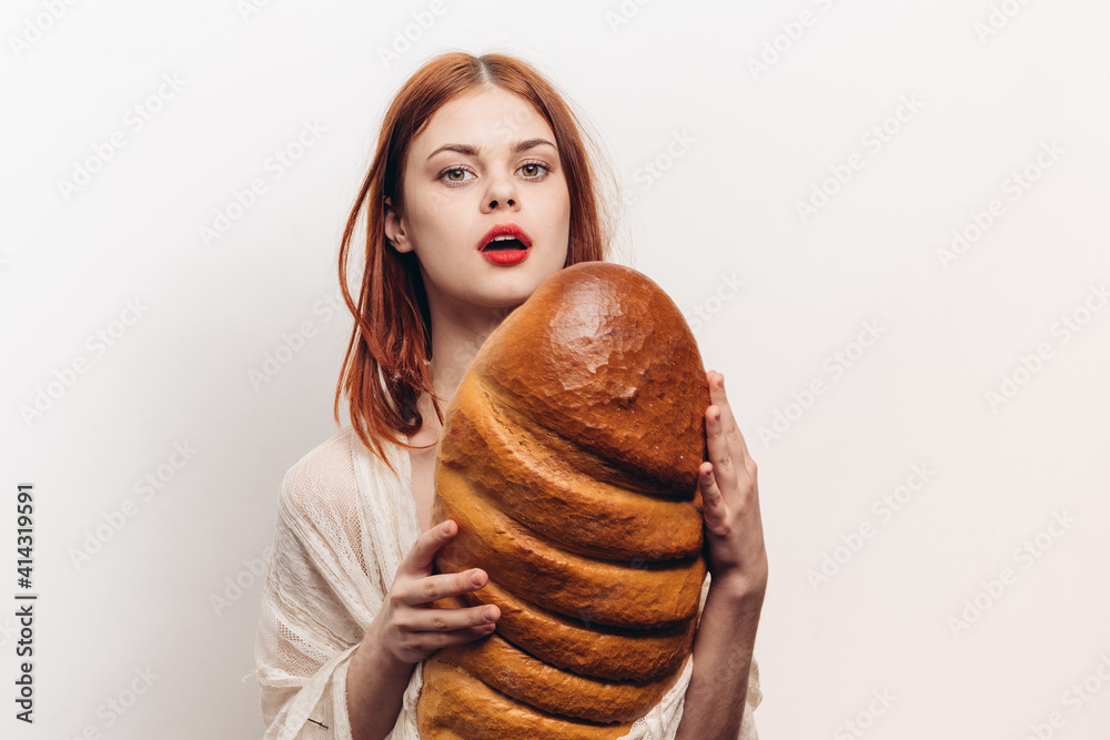 loaf of bread flour products loaf young woman on a light background emotions