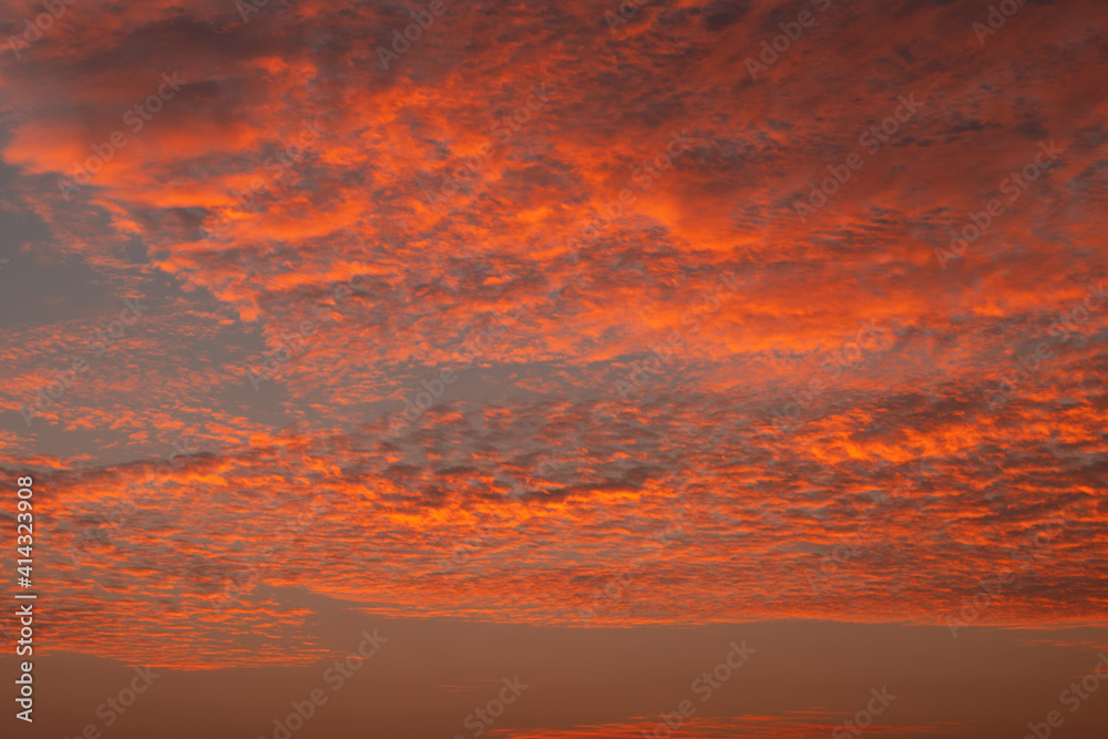 Golden hour sunset dramatic cloudscape photograph, showing off nature's beauty.