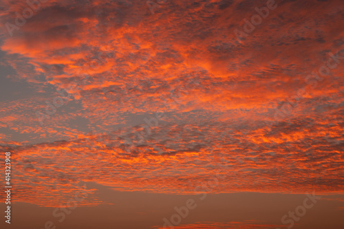 Fototapeta Naklejka Na Ścianę i Meble -  Golden hour sunset dramatic cloudscape photograph, showing off nature's beauty.