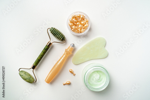 Organic Facial cosmetics. Spa treatments. Jade roller for facial massage. essence for skin health. gouache scraper  face cream  ampoules for wrinkles on the eyelids.