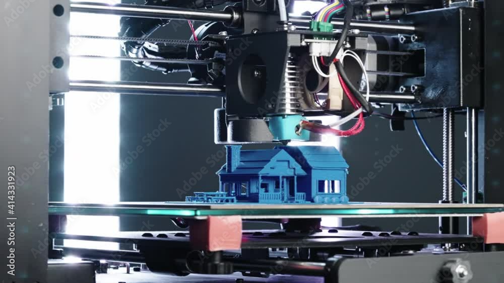 Close up of 3d Printer printing blue house slider shot in 4k Close up of 3d Printer printing blue house slider shot in 4k