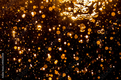 Gold bokeh from light in water