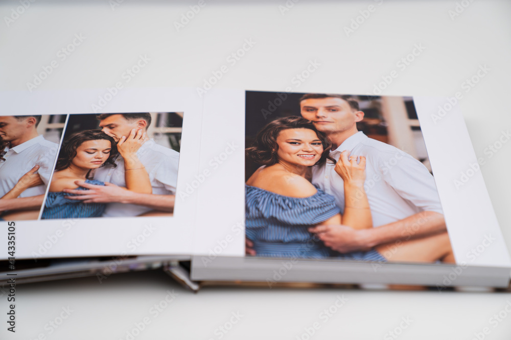 pages of photobook from photo shoots of a beautiful happy couple 