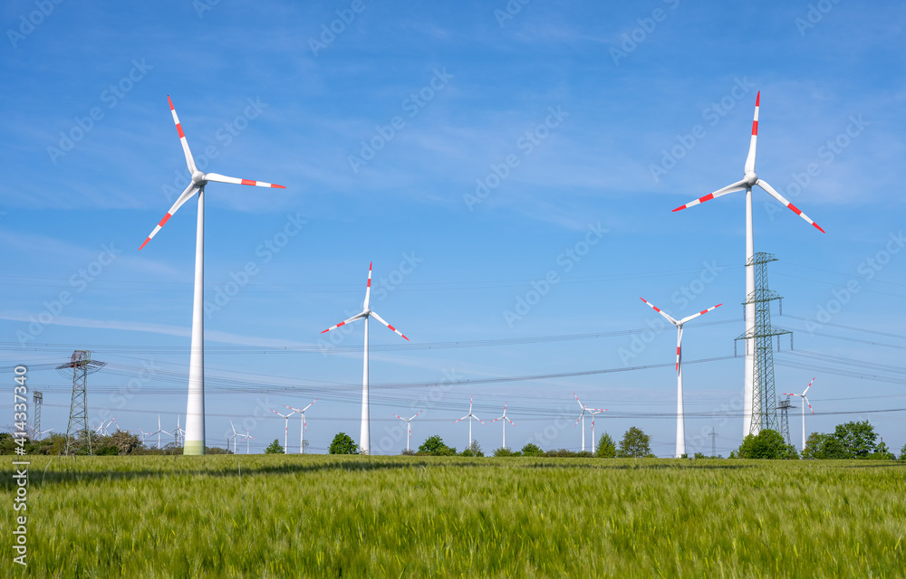 Wind power turbines and power lines seen in Germany Wind power turbines and power lines seen in Germany