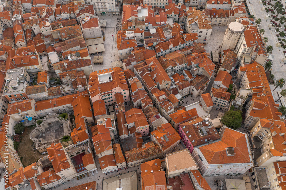 Aerial drone west side view of Diocletian Palace by riva in Split old town in Croatia in sunrise