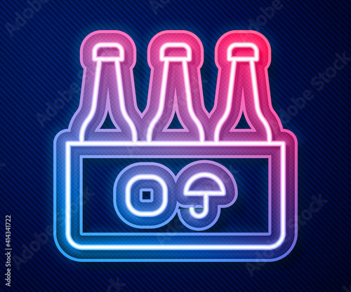 Glowing neon line Pack of beer bottles icon isolated on blue background. Case crate beer box sign. Vector.