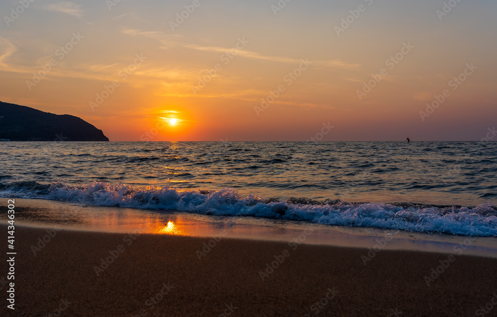 sunset on the beach in Tuscany, Italy.