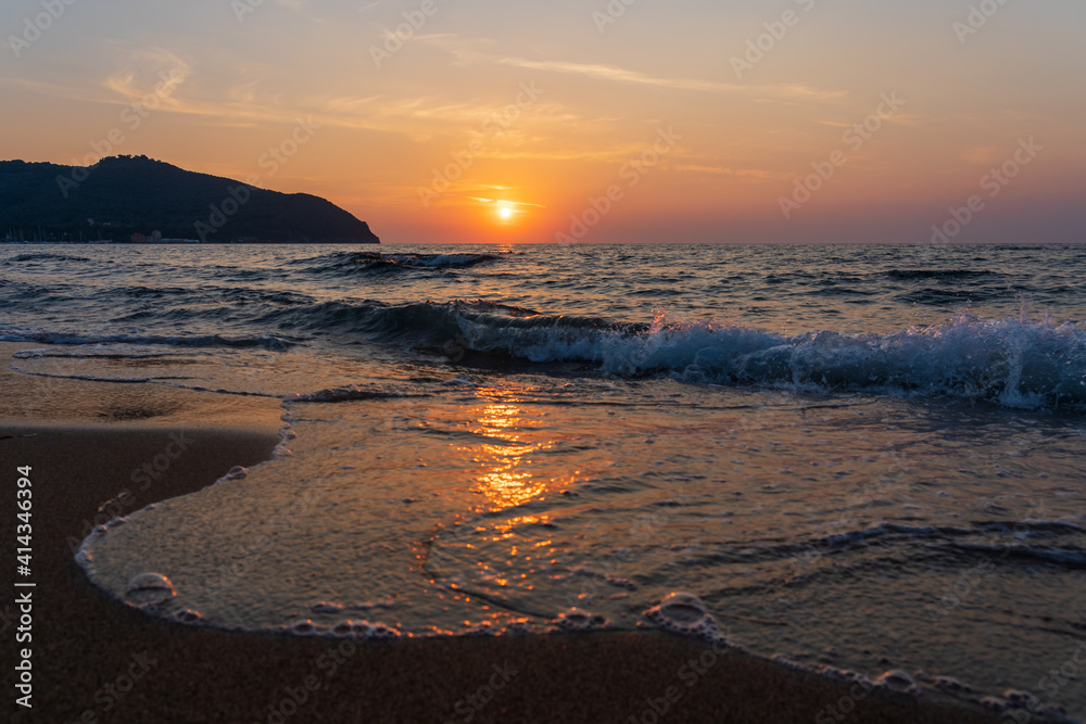 sunset on the beach in Tuscany, Italy.