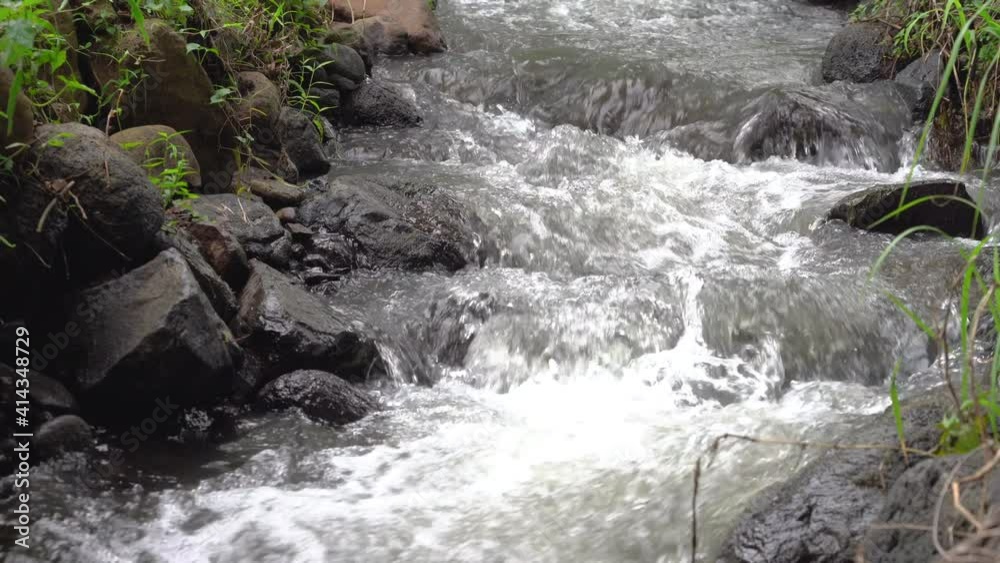 Small river flowing clean water from the hill nearby Small river flowing clean water from the hill nearby