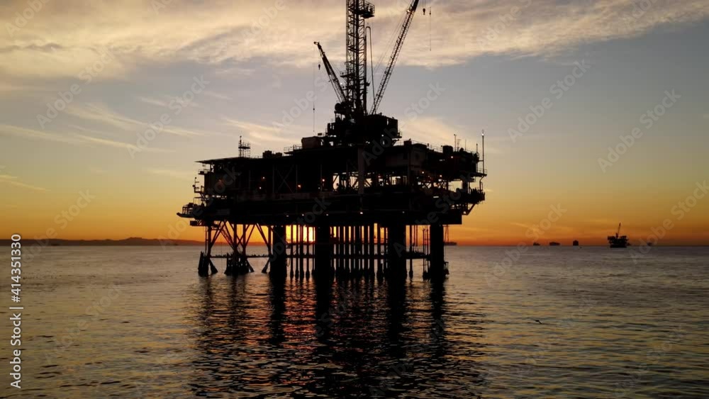 Aerial shot of an offshore oil platform at sunset Aerial shot of an offshore oil platform at sunset