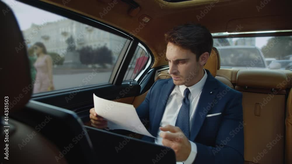 Stressed business man getting angry with poor results in business car.
