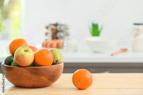 Fototapeta Naklejka Na Ścianę i Meble -  Bowl with fruits on table in modern kitchen