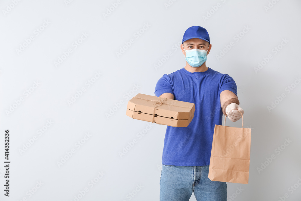 Courier of food delivery service on light background Courier of food delivery service on light background