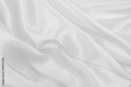 Smooth elegant white silk or satin luxury cloth texture as wedding background. Luxurious background design