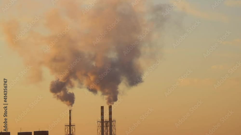 Timelapse. Smoke is coming from the chimney of the plant. Timelapse. Smoke is coming from the chimney of the plant.