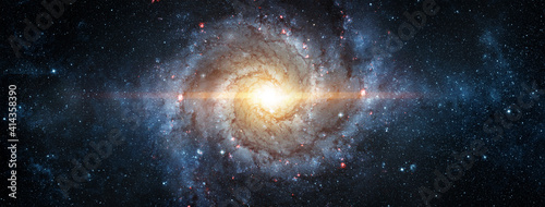 Fotografiet A view from space to a spiral galaxy and stars