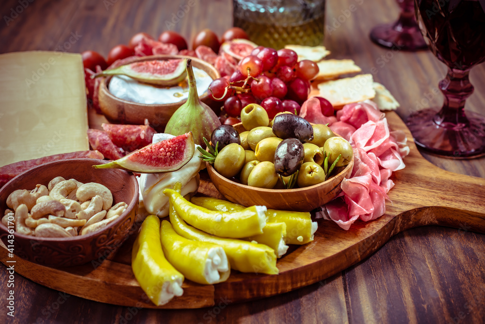 Charcuterie, antipasti platter with assortment of italian salami, cheese, camembert and olives