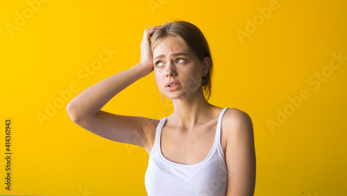 Young beautiful woman having headache