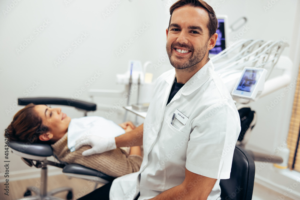 Successful male dentist in his clinic Successful male dentist in his clinic