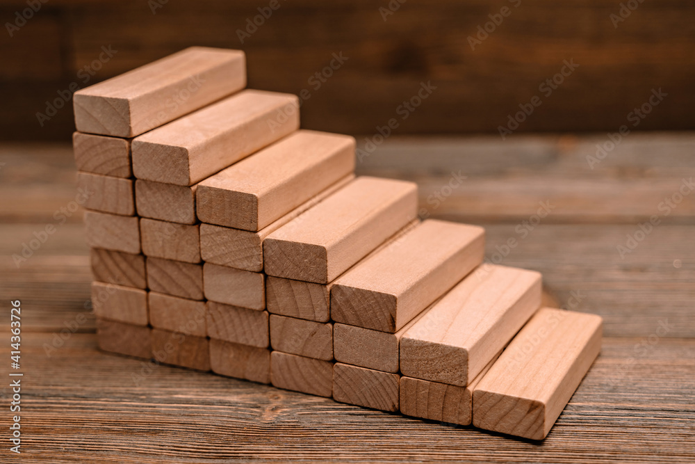 Wooden block ladder as a concept planning, risk and strategy in business Wooden block ladder as a concept planning, risk and strategy in business