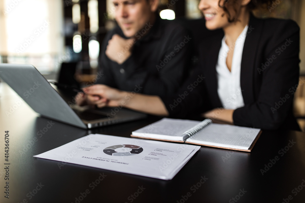 Close-up image of business people working together. Close-up image of business people working together.