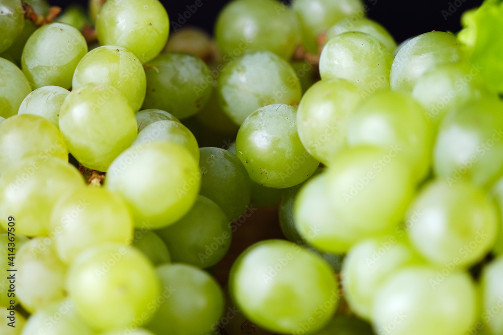 Green grapes on wooden background. Frash fruit. Healfy food. Close up of green grapes. Macro Green grapes on wooden background. Frash fruit. Healfy food. Close up of green grapes. Macro