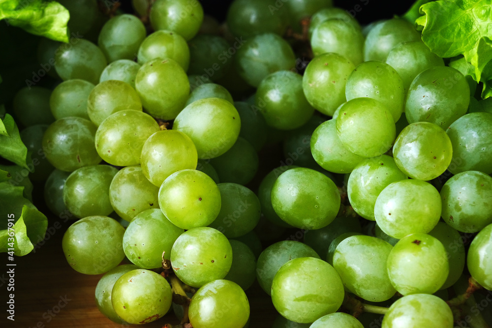 Green grapes on wooden background. Frash fruit. Healfy food. Close up of green grapes. Macro Green grapes on wooden background. Frash fruit. Healfy food. Close up of green grapes. Macro