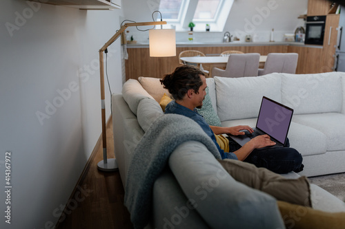 Man using wireless technology at home