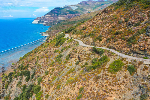 Aerial view of the famous D80 road around Cap Corse peninsula, the important tourist path in Corsica Island. Haute-Corse, France. Tourism and vacations concept photo