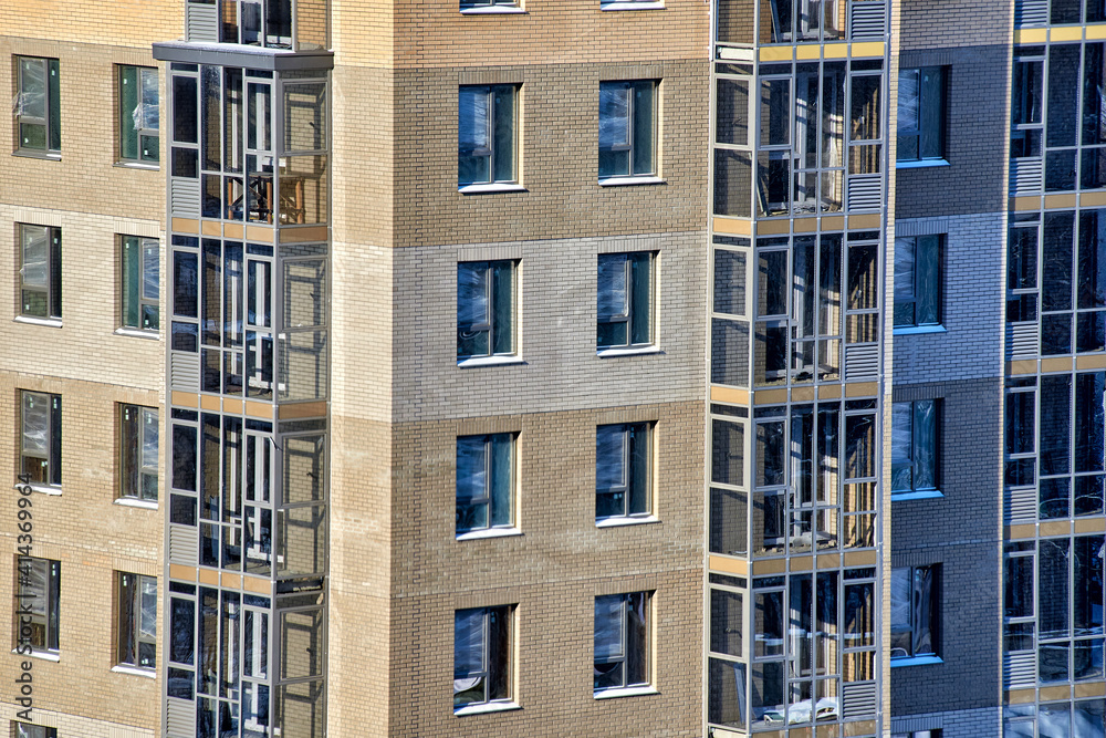 Naklejka premium detail of a new multi-storey residential building. construction