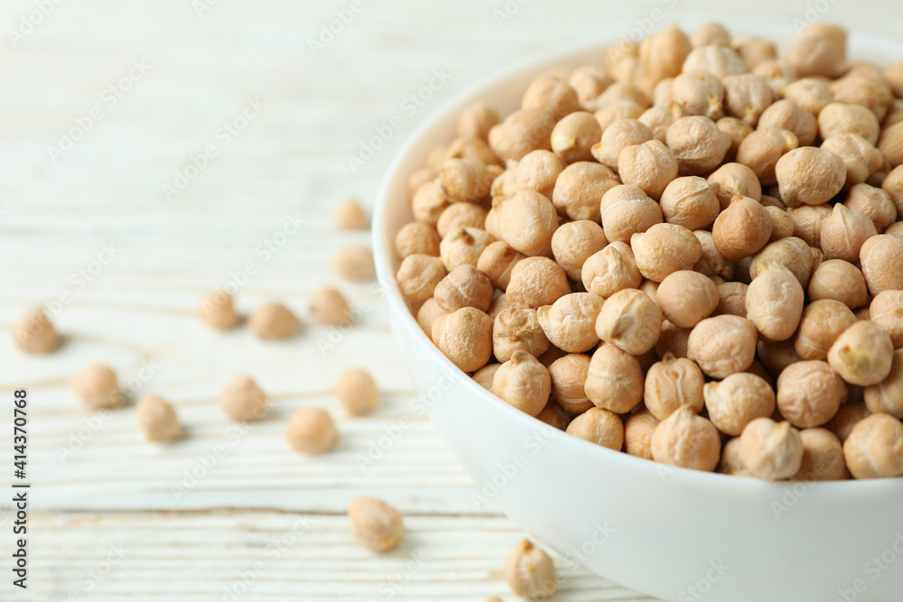 Bowl with chickpea on white wooden table Bowl with chickpea on white wooden table