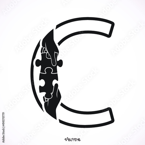 Letter C Concept. Hand of business man connecting puzzle elements , team work