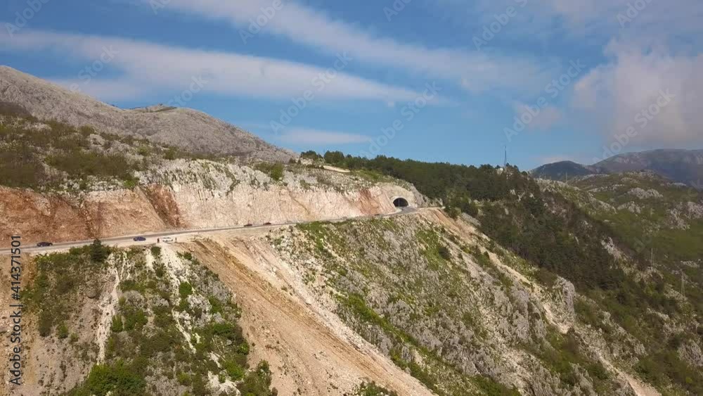 Cars entering and leaving the tunnel on the mountain near the city of Budva MontenegroCars entering and leaving the tunnel on the mountain near the city of Budva Montenegro Cars entering and leaving the tunnel on the mountain near the city of Budva MontenegroCars entering and leaving the tunnel on the mountain near the city of Budva Montenegro