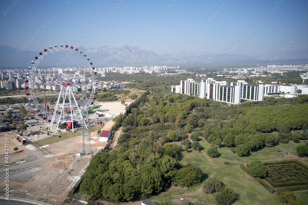 Landscape of Antalya with view of Ferris wheel. Travel to Turkey. Landscape of Antalya with view of Ferris wheel. Travel to Turkey.