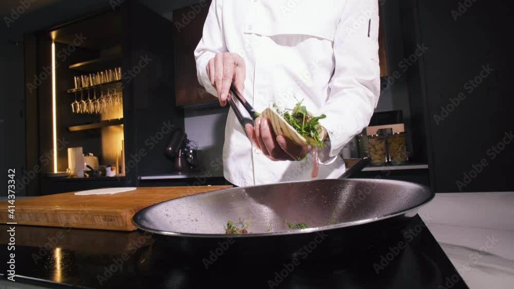 Chef Preparing Fried Vegetarian Vegetables Dish For Dinner In Restaurant Kitchen. Cooking Delicious Vegan Food In Wok Frying Pan. Man Person Making Veggie Meal In Vegetarian Eatery Cuisine. Close up