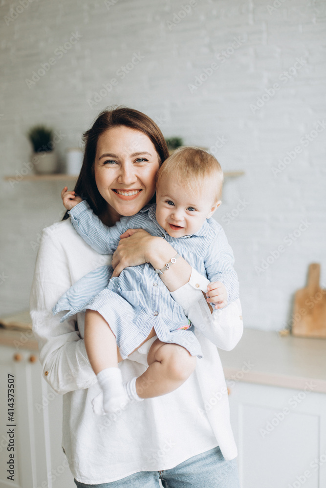 Happy mother and infant daughter playing together at home. Childhood, family concept Happy mother and infant daughter playing together at home. Childhood, family concept
