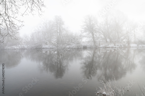 Misty reflections in the Teviot river in the Scottish Borders, UK