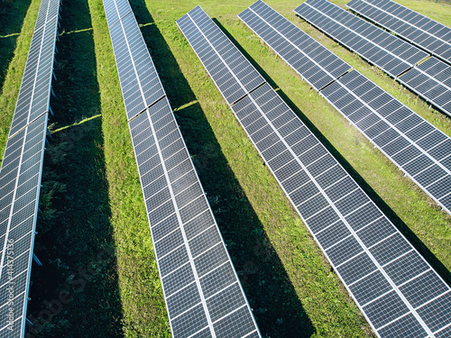 Long energy solar panels top view. View from above of huge solar panels in the field. Energy concept