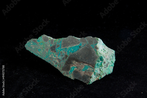 a  green malachite mineral sample on a black background photo