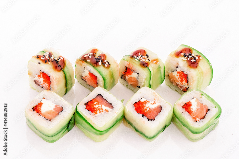 Roll green dragon. Roll with avocado and salmon isolated on white background. Close-up
