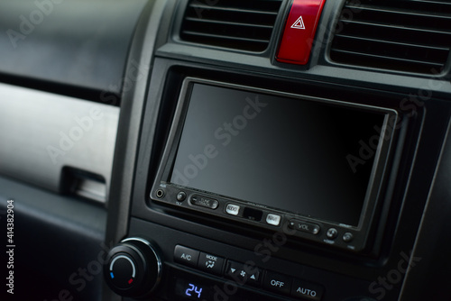 A built-in screen on a modern car.